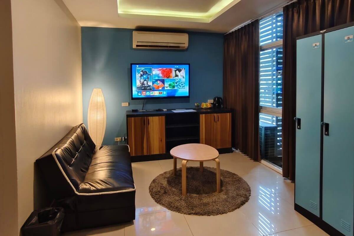 Quadruple Room | Living area | Flat-screen TV