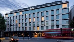 A multi-story hotel with a modern facade, large windows, and a prominent 'Ruby' sign. - Ruby Zoe Hotel London by IHG (London)