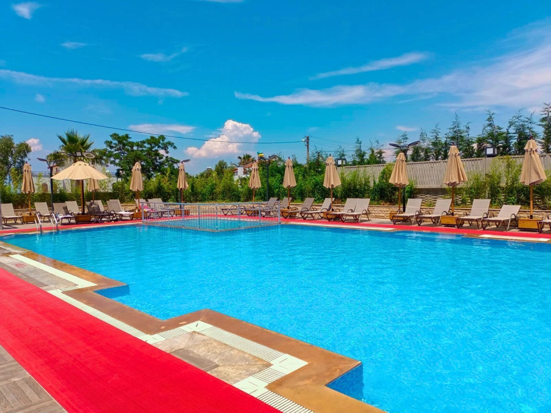 Indoor pool, seasonal outdoor pool, pool umbrellas, sun loungers