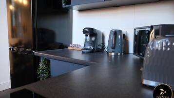 House, Multiple Beds | Private kitchen | Fridge, microwave, oven, stovetop