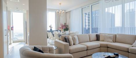 Deluxe Apartment | Living area | 55-inch Smart TV with cable channels, TV