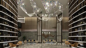 A modern interior with a curved sofa, bookshelves, and a decorative ceiling. - Pullman Huai’an (Huai'an)