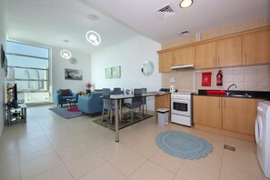 Standard Apartment | Private kitchen | Full-sized fridge, microwave, toaster, cookware/dishes/utensils