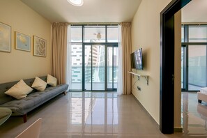 Classic Apartment | Living area | 43-inch Smart TV with cable channels, TV - Tanin - Apartment Amidst Lively Area With Pool and Balcony (Dubai)