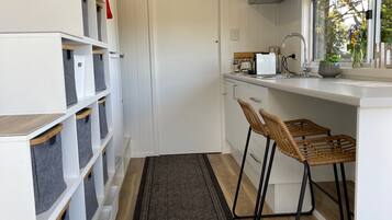 Microwave, coffee/tea maker, toaster, cookware/dishes/utensils