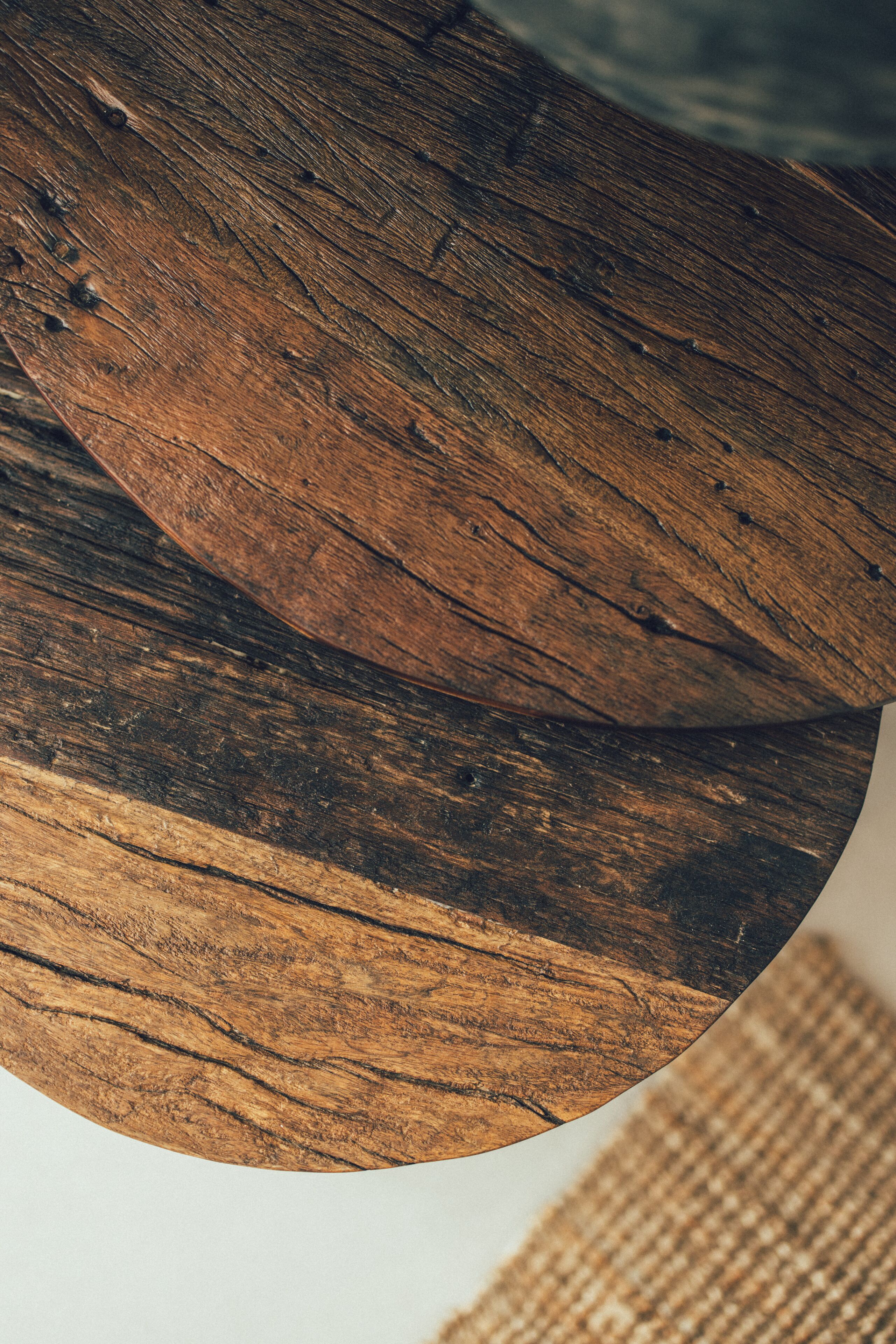 A close-up of a wooden surface with visible grain and texture.