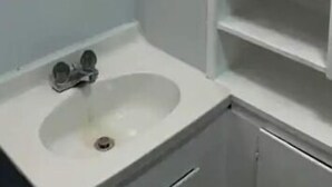 A bathroom with a white sink, a mirror, and a cabinet. - Main St., Sturgis Rally Rental!! Enough Said!! (Sturgis)