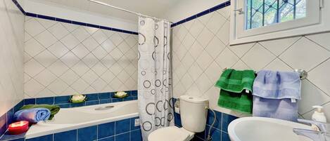 Bathtub, hair dryer, towels