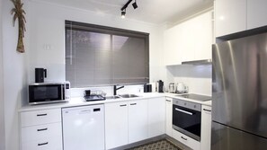 Microwave, oven, dishwasher, dining tables