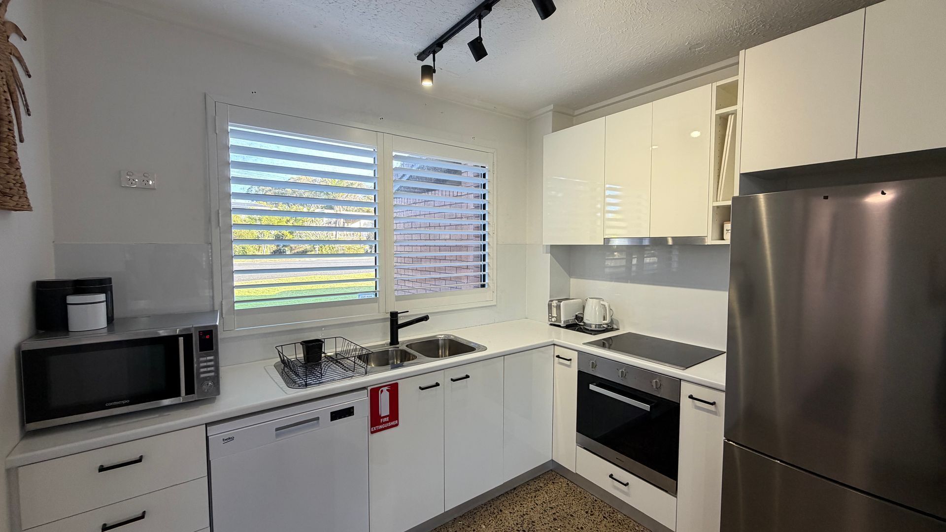 Microwave, oven, dishwasher, dining tables