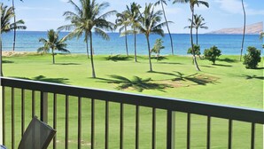 A golf course with a view of the ocean and palm trees. - Oceanfront condo on wing of complex near beach, pool - Perfect for Sunsets (Kihei)
