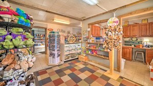A cozy, well-lit shop with shelves of plush toys and a variety of items for sale. - Lynnhurst Resort Motel #9...Dog Friendly Jet Ski Rentals on site (Murray)