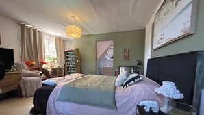 A bedroom with a bed, a desk, a chair, a bookshelf, and a window. - Chambre LES Pins (Mimizan)