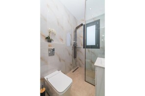 Shower, hair dryer, towels, soap