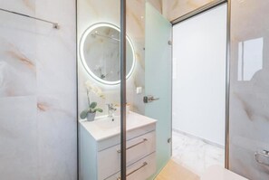 Shower, hair dryer, towels, soap