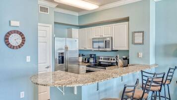 Coffee/tea maker, fridge, microwave, oven