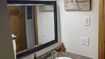 Shower, hair dryer, towels, toilet paper