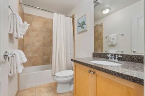 Combined shower/bathtub, hair dryer, towels, soap