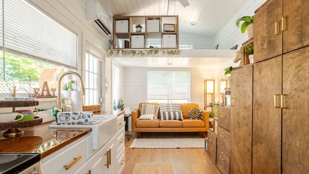 A kitchen with white cabinets, a wooden countertop, and a built-in bookshelf. - Tiny home 🏡 Northgate- 15min to downtown (Seattle)