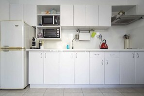 Fridge, microwave, stovetop, coffee/tea maker