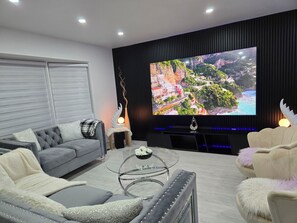 Smart TV, fireplace, table football, books