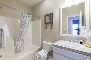Combined shower/bathtub, hair dryer, towels, soap