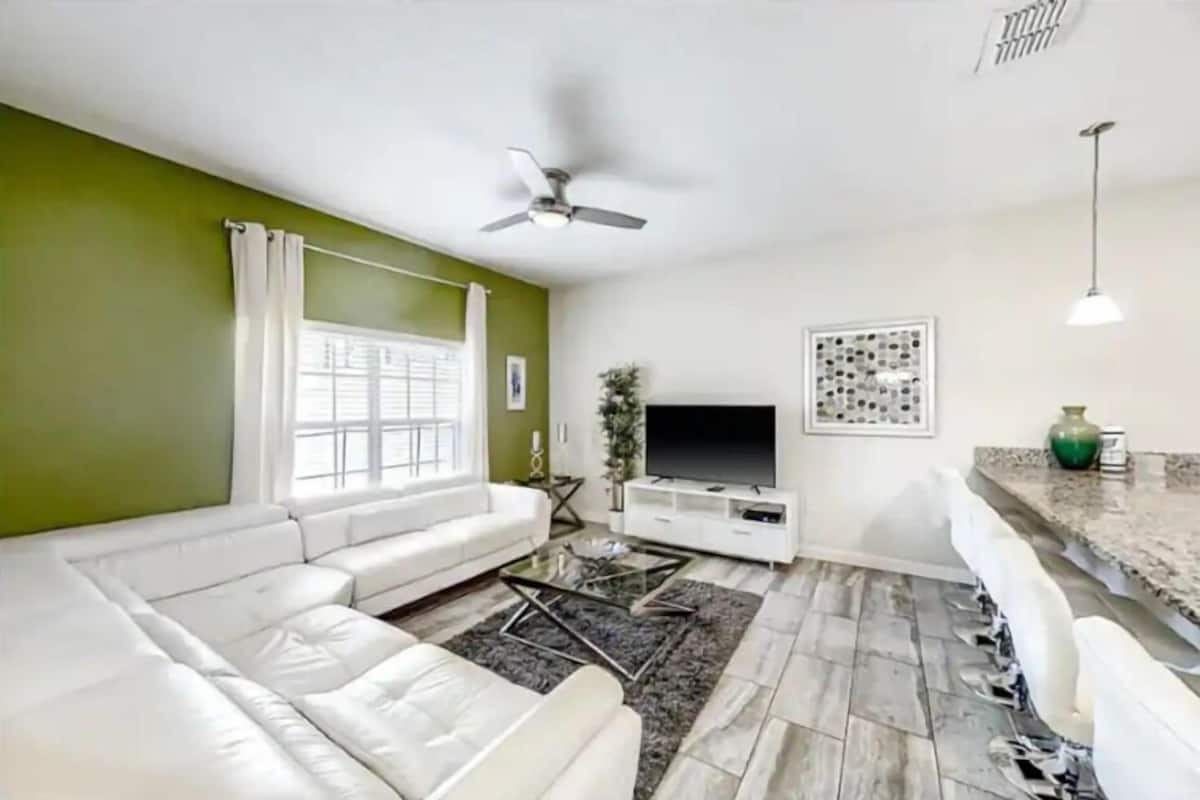 Deluxe Townhome | Living area | Flat-screen TV
