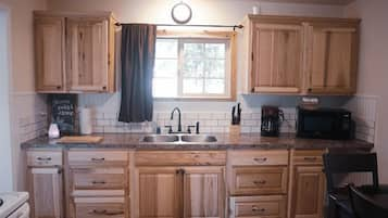 Family Cabin | Private kitchenette | Full-sized fridge, microwave, stovetop, coffee/tea maker