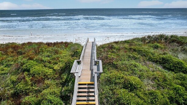 A wooden boardwalk leading to a beach with a view of the ocean. - Quail Hollow A8-1U:  Beach Condo with Pool Access - Family Friendly (St. Augustine)