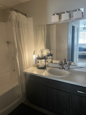 Combined shower/tub, hair dryer, towels, soap