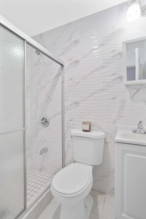 Shower, hair dryer, towels, soap