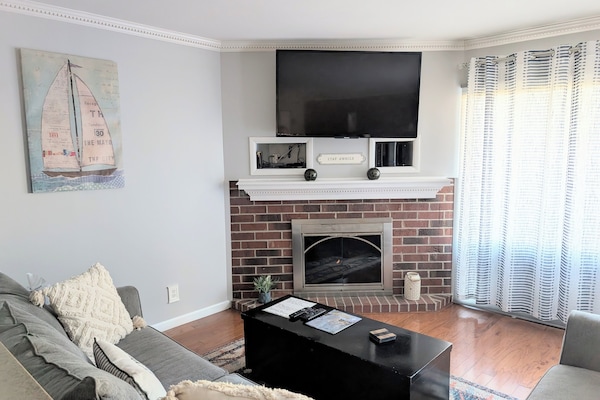 Living room with gas fireplace, streaming/cable tv, Wii/DVD player