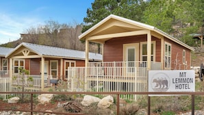 A wooden building with a porch and a sign that reads 'MT LEMMON HOTEL.' - Mt Lemmon Hotel Summerhaven Cabin 12 (Mount Lemmon)