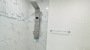 Bathtub, hair dryer, towels, soap