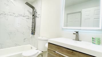 Bathtub, hair dryer, towels, soap