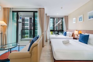 Triple Room, Multiple Beds, Pool View (Studio) | Free minibar items, in-room safe, individually furnished, desk