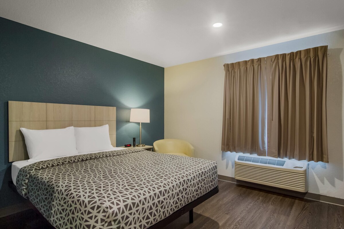 Desk, laptop workspace, blackout curtains, free WiFi