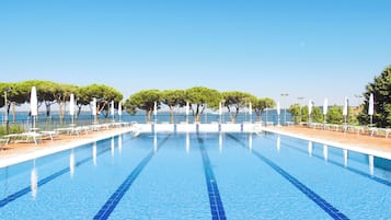 Seasonal outdoor pool, open 10:00 AM to 6:00 PM, pool umbrellas