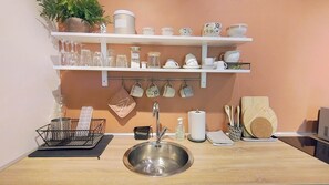 Fridge, microwave, stovetop, coffee/tea maker