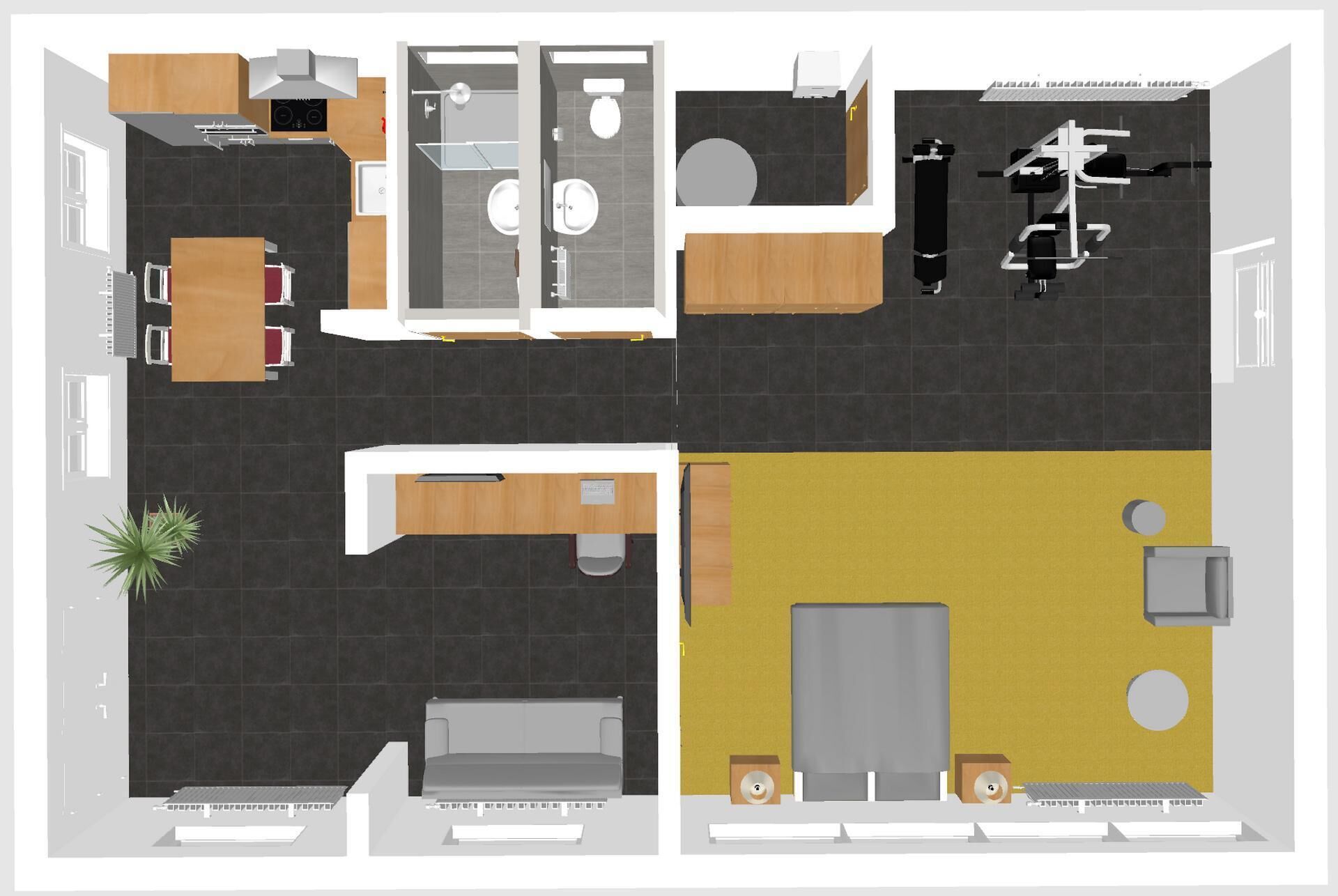 Un plan d’aménagement de chambre d’hôtel comprenant un lit, un bureau, une chaise et un petit coin salon.