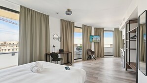 A hotel room with a bed, desk, chair, and a TV. - All Suites Appart Hôtel | Paris Ouest - Colombes (Colombes)