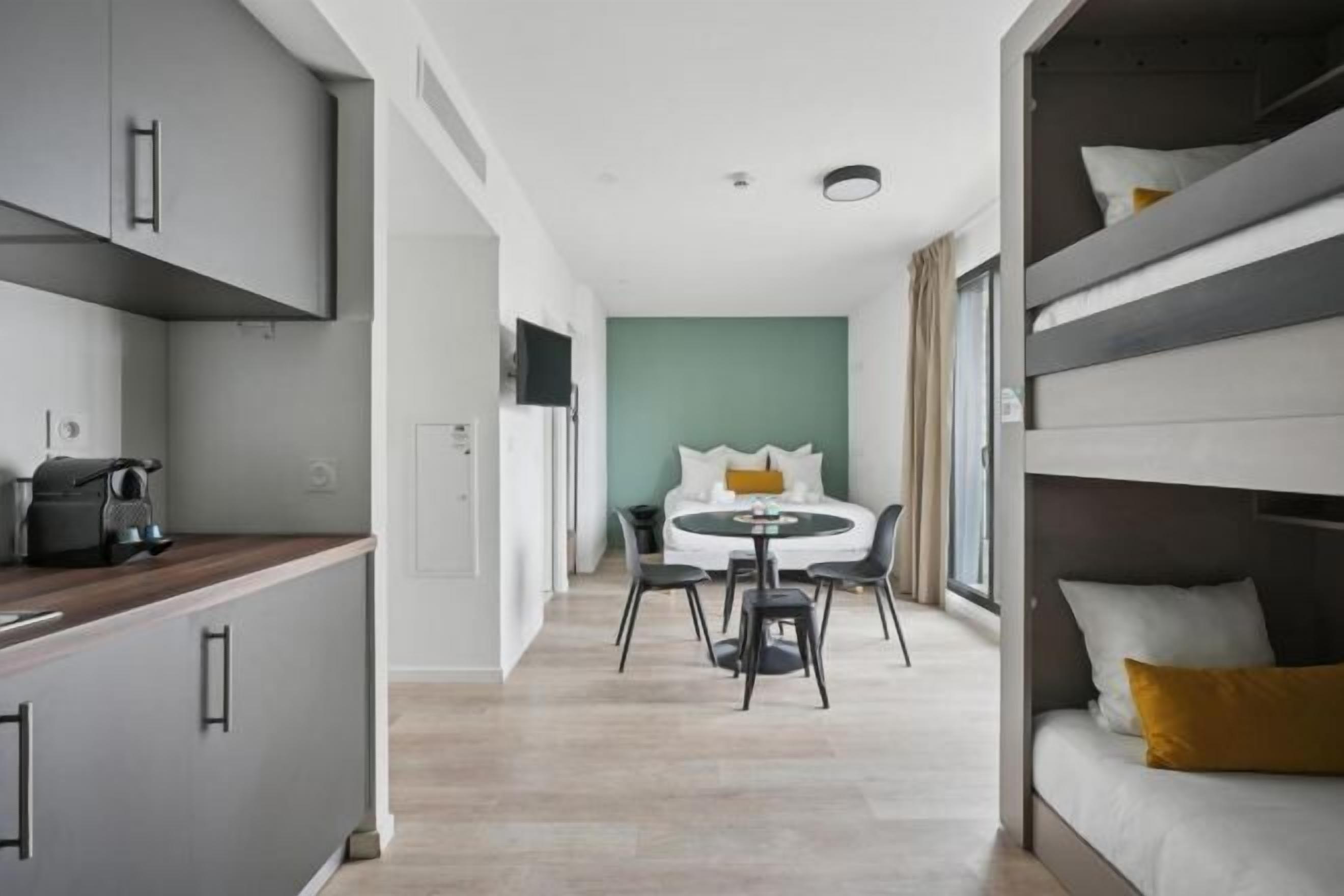 Premium bedding, laptop workspace, blackout drapes, soundproofing