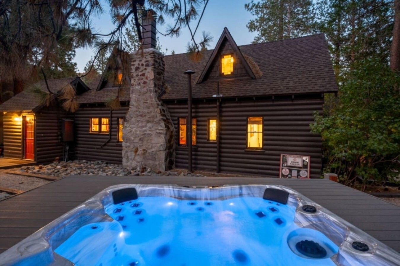 Unwind in this charming mountain cabin retreat featuring a private hot tub under the stars.