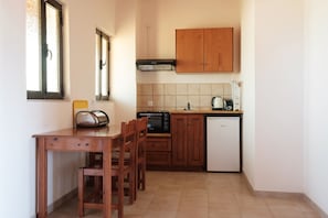 Mini-fridge, stovetop, electric kettle, toaster