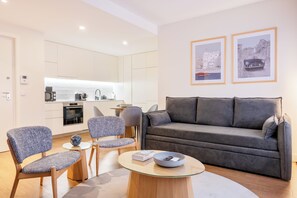 Deluxe Apartment, 1 Double Bed with Sofa bed, City View | Living area | 28-inch Smart TV with cable channels, TV, MP3 dock - Catarina Serviced Apartments (Porto)