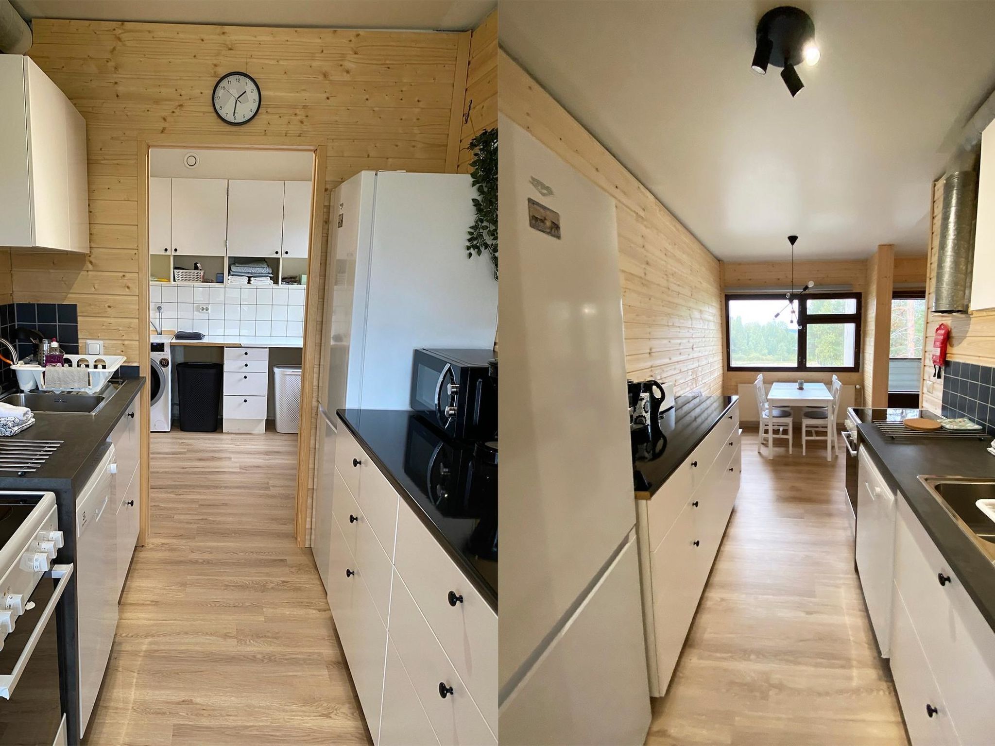 Una cucina moderna con pareti in legno, un orologio e un'area pranzo con vista.