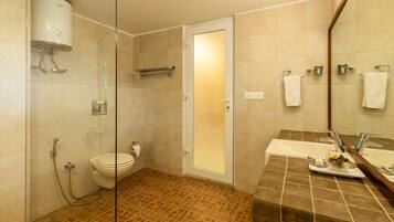 A bathroom with a shower, toilet, and sink.