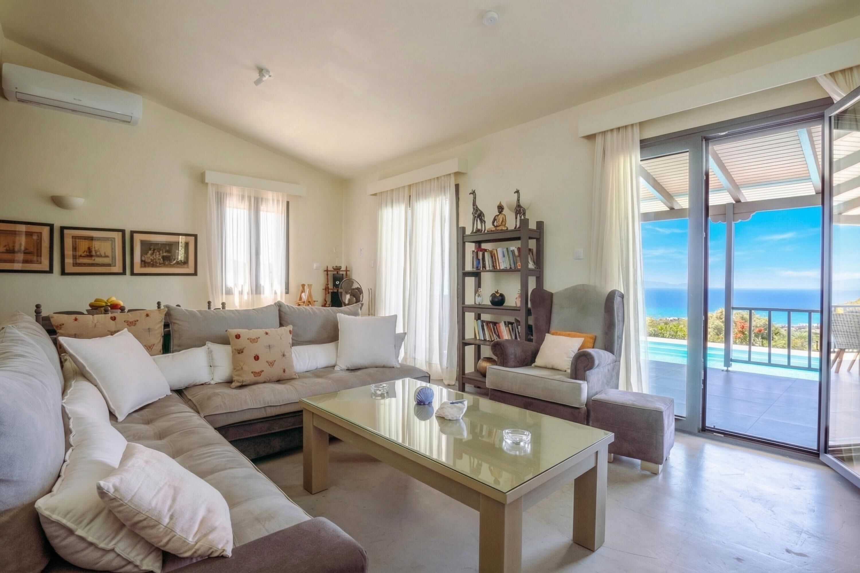 Family House, Multiple Bedrooms (Villa Filokalia With Exceptional View) | Living area | 21-inch TV with cable channels, fireplace