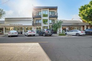 A multi-story building with a ground-level store named 'Mailash & Browns' and a second-floor store named 'atelier.' - NEW|Palo Verde Suite @ Cedara| Penthouse|Old Town (Scottsdale)