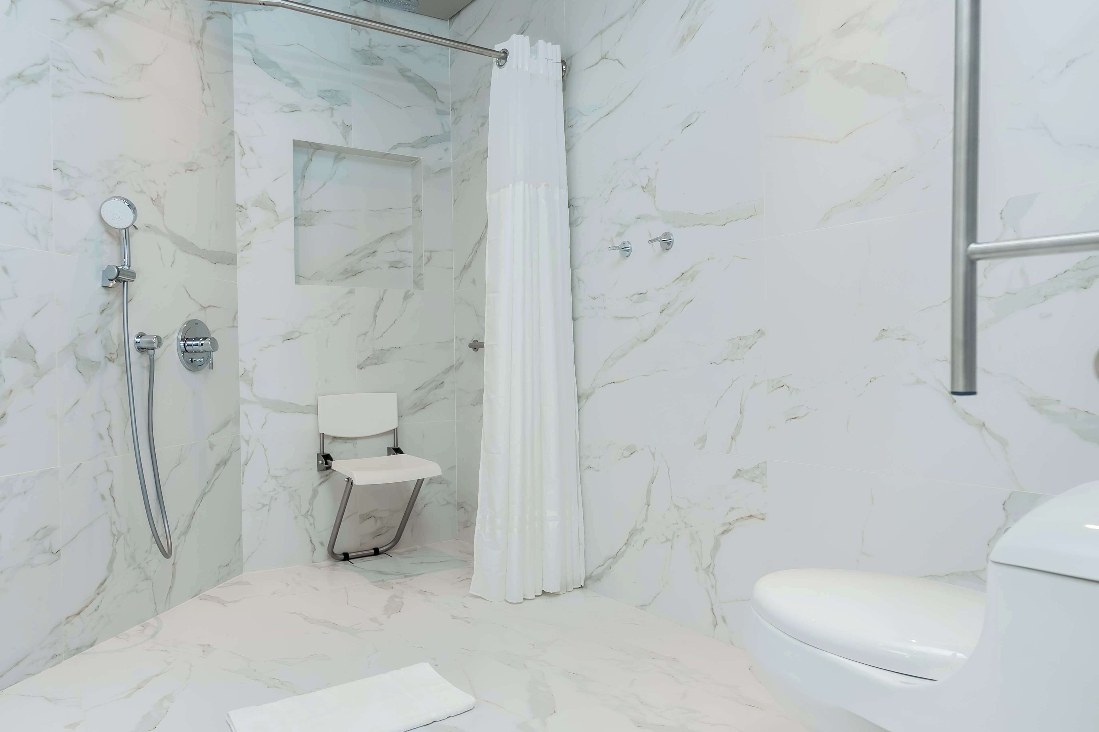 Room, 1 King Bed (Mobility, Roll-in Shower) | Bathroom shower